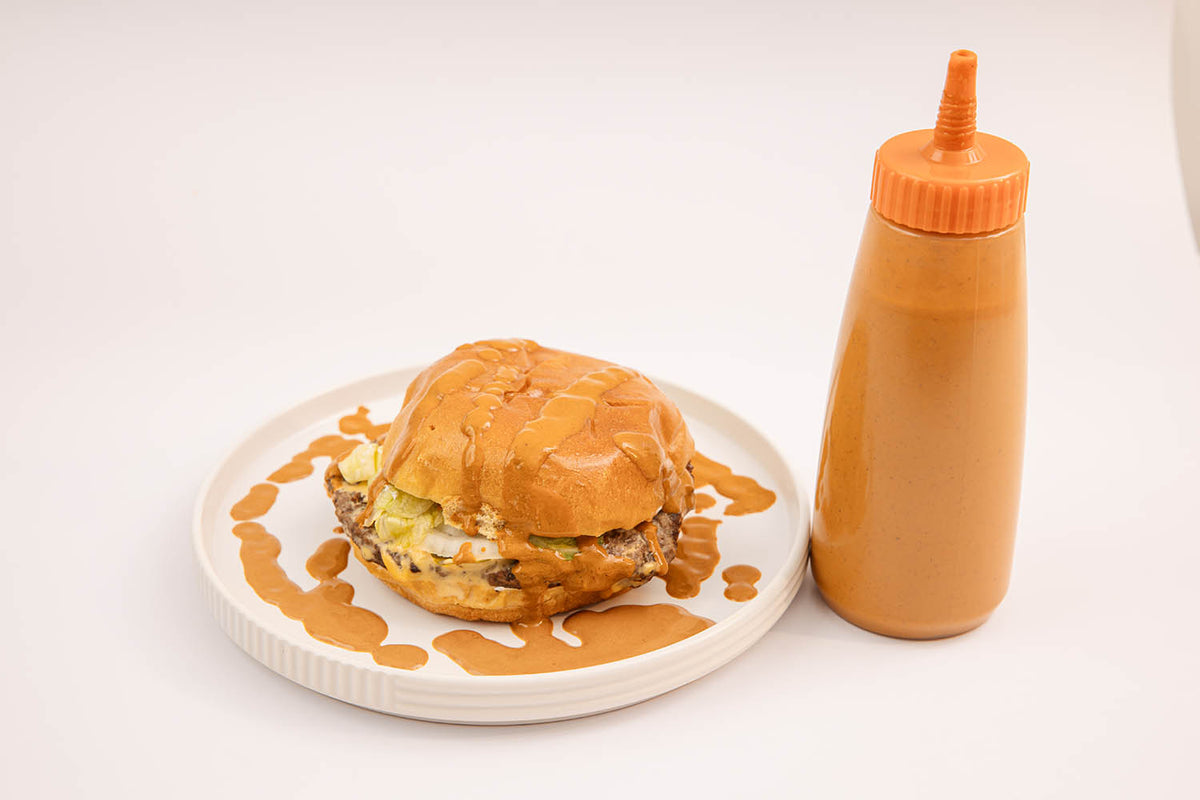 Hamburger topped with Mole Creamy Dressing Amá